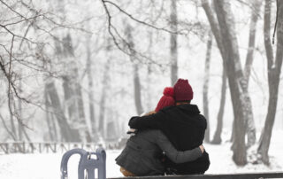 Lovely Couple Sitting on Bench