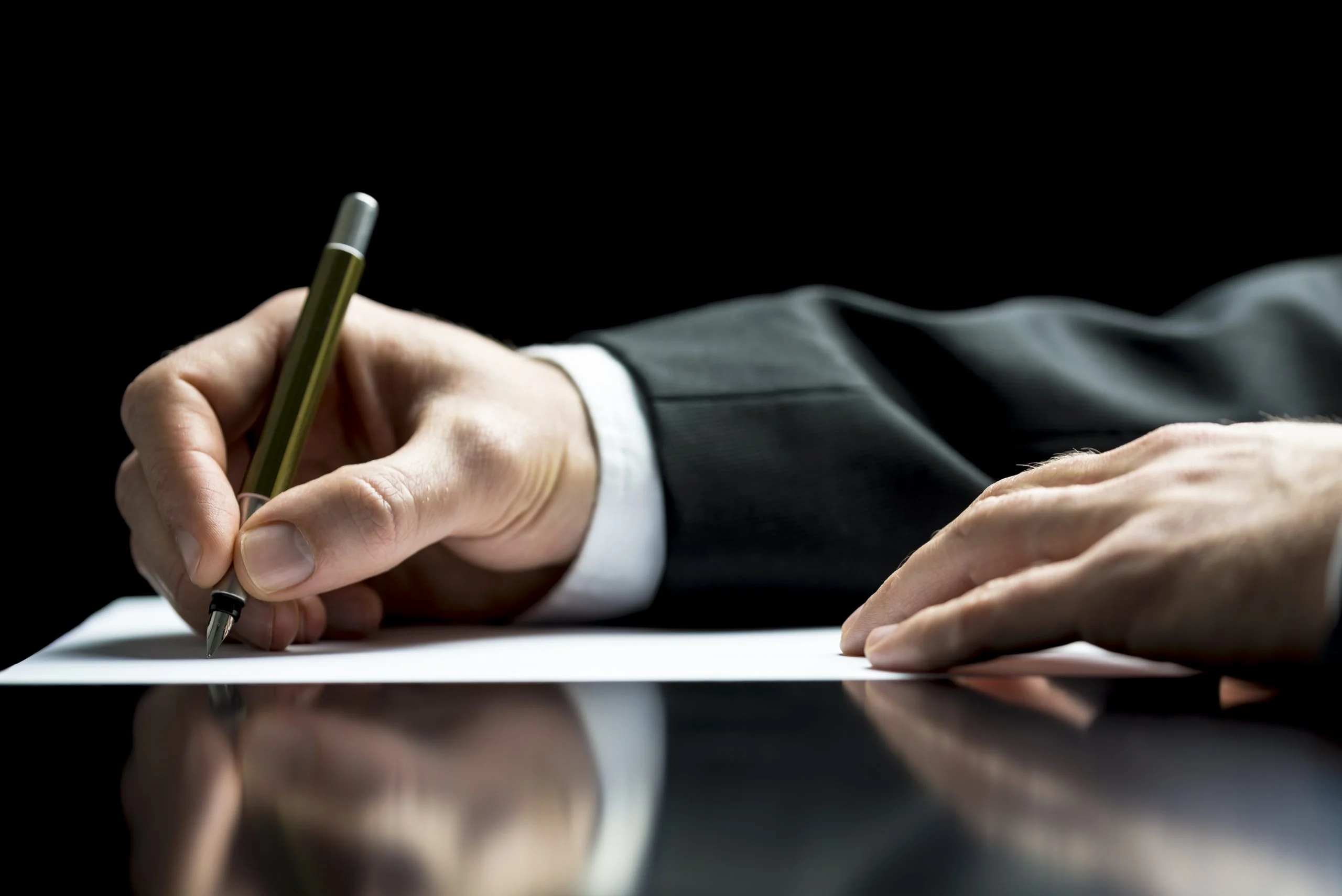 man writing an obituary